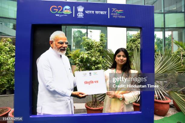 Beneficiary candidates after receiving their appointment letters pose with Prime Minister Narendra Modi cut out pose for Photo during the distribute...