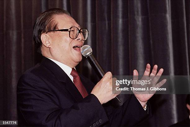 Chinese President Jiang Zemin sings on October 28, 2002 in San Francisco, California. Jiang had a brief stopover in San Francisco where he attended a...