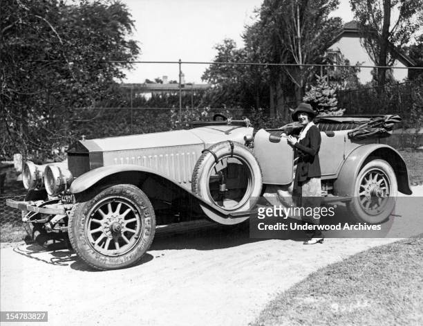 Movie star Mabel Normand gets ready to take a drive around Long Island in Raymond Hitchcock's Rolls Royce, Great Neck, New York, September 19, 1921.