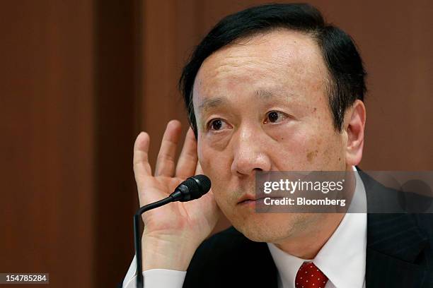 Kaoru Kato, president and chief executive officer of NTT DoCoMo Inc., listens during a news conference in Tokyo, Japan, on Friday, Oct. 26, 2012. NTT...