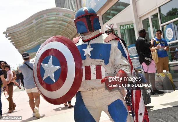 Boba Fett/Captain America mashup cosplayer walks outside the convention center during San Diego Comic-Con International in San Diego, California, on...