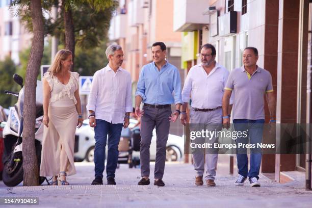 The president of the Popular Party of Andalusia, Juanma Moreno, walks accompanied with the head of lists in Seville during the attention to media in...