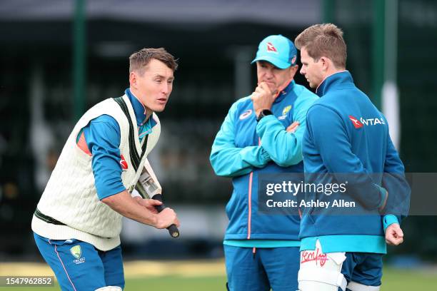 Marnus Labuschagne of Australia chats with teammate Steve Smith and assistant coach Andy Flower during Australia's Nets and training session at...