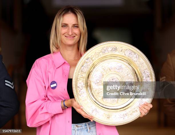 Marketa Vondrousova of Czech Republic holds the Women's Singles Trophy following her victory in the Women's Singles Final on day fourteen of The...