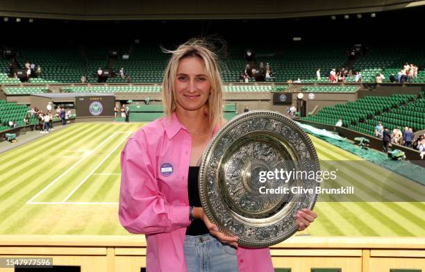 Marketa Vondrousova of Czech Republic holds the Women's Singles Trophy following her victory in the Women's Singles Final on day fourteen of The...