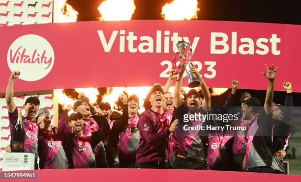 Lewis Gregory of Somerset lifts the Vitality Blast T20 trophy alongside team mates following the Vitality Blast T20 Final between Essex Eagles and...