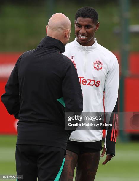 Manager Erik ten Hag, Marcus Rashford of Manchester United arrives ahead of a pre-season training session at Carrington Training Complex on July 15,...