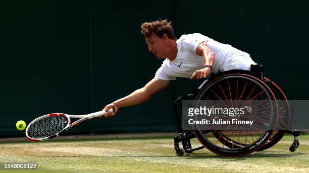 Niels Vink of Netherlands stretches to play a forehand during the Quad Wheelchair Singles Final against Heath Davidson of Australia on day fourteen...