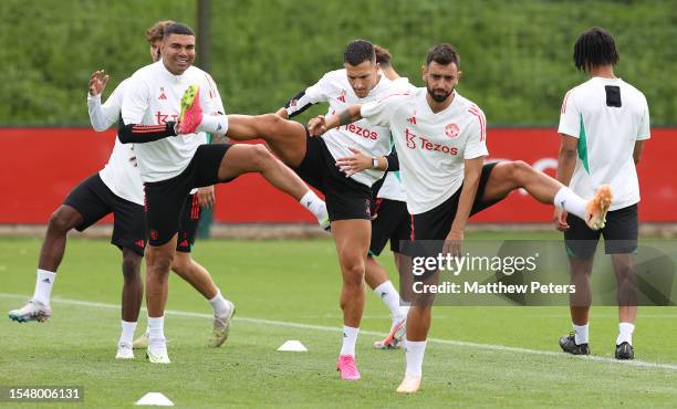 Casemiro, Diogo Dalot, Bruno Fernandes of Manchester United arrives ahead of a pre-season training session at Carrington Training Complex on July 15,...