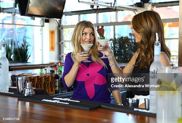Voli Vodkas Brand Owner, Fergie, and Maria Menounos Visit with Extra at The Grove on October 16, 2012 in Los Angeles, California.