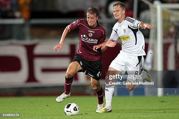 Alessandro Bernardini of AC Livorno fights for the ball with Damjan Djokovic of AC Cesena during the Serie B match between AS Livorno and AC Cesena...