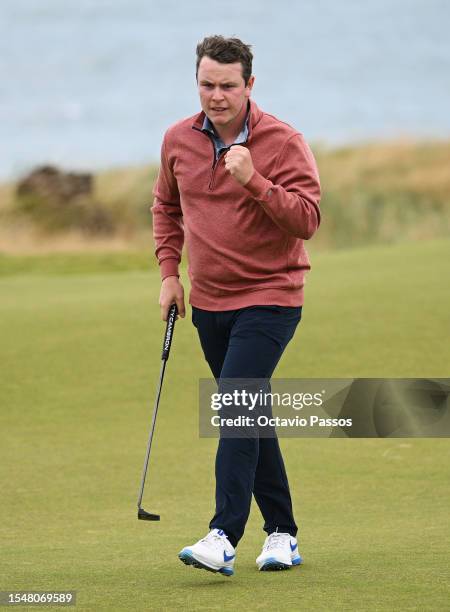 Robert MacIntyre of Scotland celebrates a par putt on the 13th green during Day Four of the Genesis Scottish Open at The Renaissance Club on July 16,...