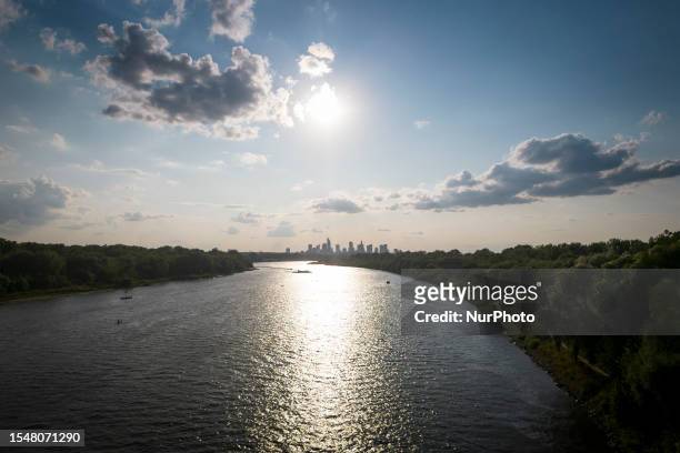 The city skyline is seen with the Vistula river leading in the foreground in Warsaw, Poland on 22 July, 2023.