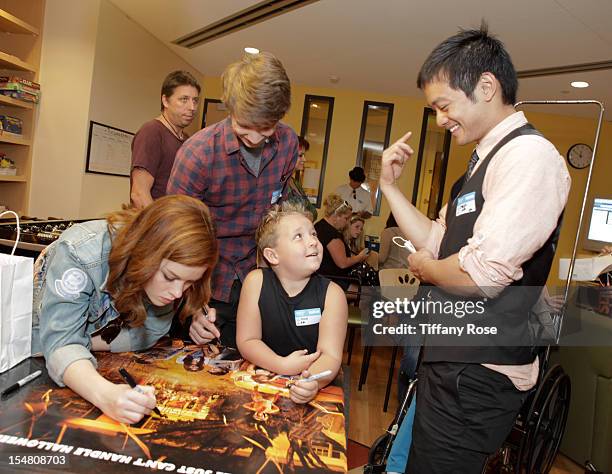 Actors Jane Levy, Thomas Mann, Jackson Nicoll and Osric Chau sign autographs at "Fun Size" Special Screening At Children's Hospital Los Angeles at...
