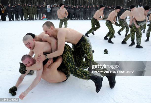 Belarus interior troops soldiers wrestle during a sport competition to mark Maslenitsa, an ancient week long celebration of saying goodbye to winter...