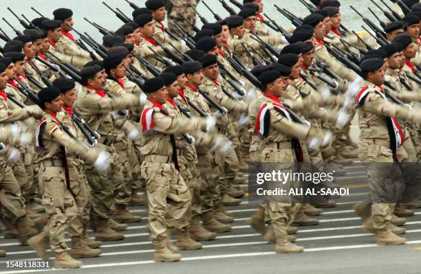 Iraqi army soldiers march to mark the 91st Army Day parade in Baghdad on January 6 weeks after US troops completed their pullout. The Armed Forces...