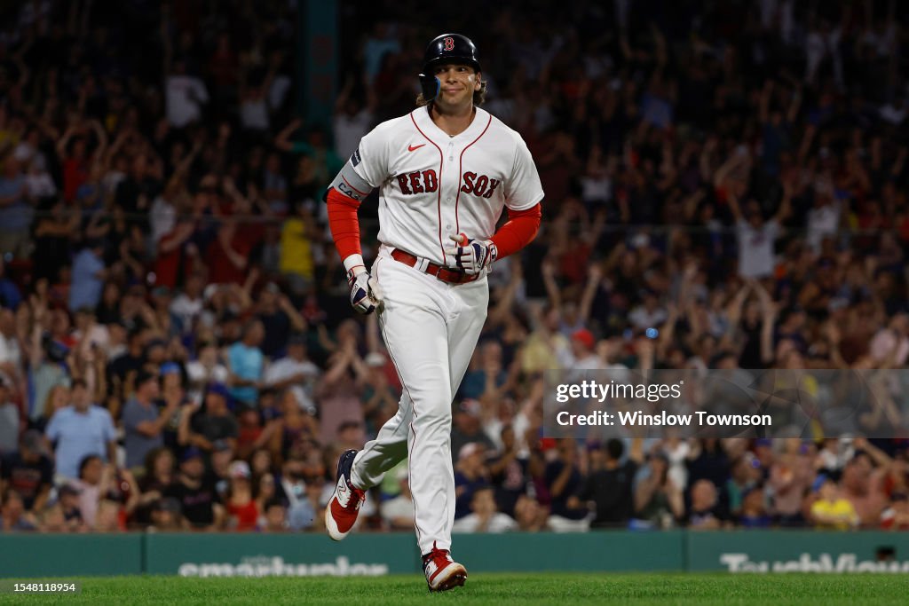 Triston Casas of the Boston Red Sox smiles at his dugout after his ...