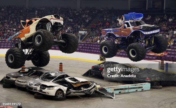 Drivers perform during the 'Monster Trucks All Out Tour' in Brampton, Ontario on July 22, 2023.