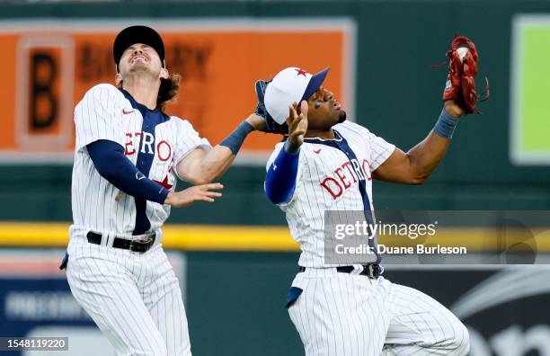 Andy Ibanez of the Detroit Tigers avoids right fielder Zach McKinstry to catch a fly ball hit by Ha-Seong Kim of the San Diego Padres during the...