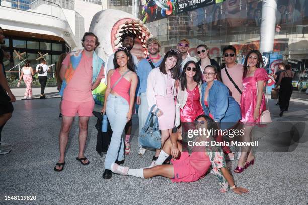 Los Angeles, CA A group of friends pose for a portrait dressed as characters in "Barbie" outside a movie theater where "Barbie" is playing at AMC...