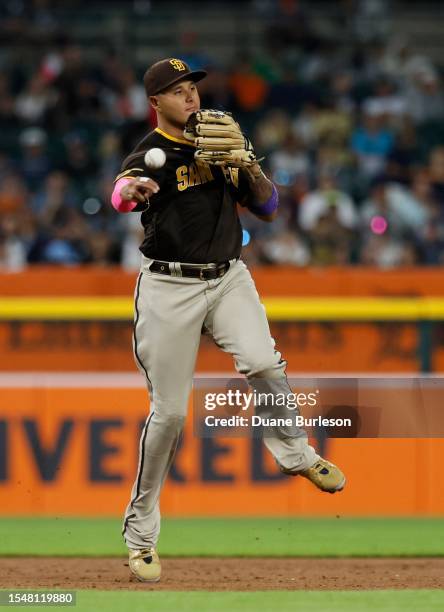 Third baseman Manny Machado of the San Diego Padres throws out Andy Ibanez of the Detroit Tigers at first base during the seventh inning at Comerica...