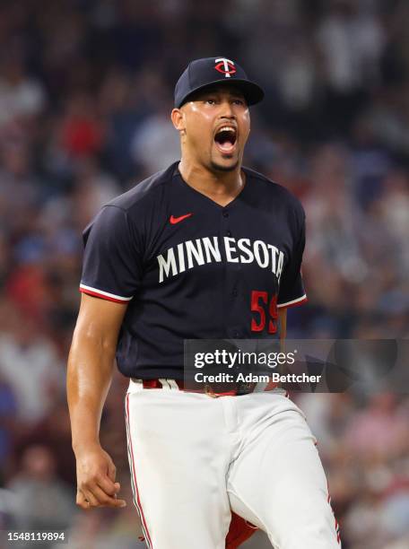 Jhoan Duran of the Minnesota Twins reacts to his strike out against the Chicago White Sox in the ninth inning at Target Field on July 22, 2023 in...