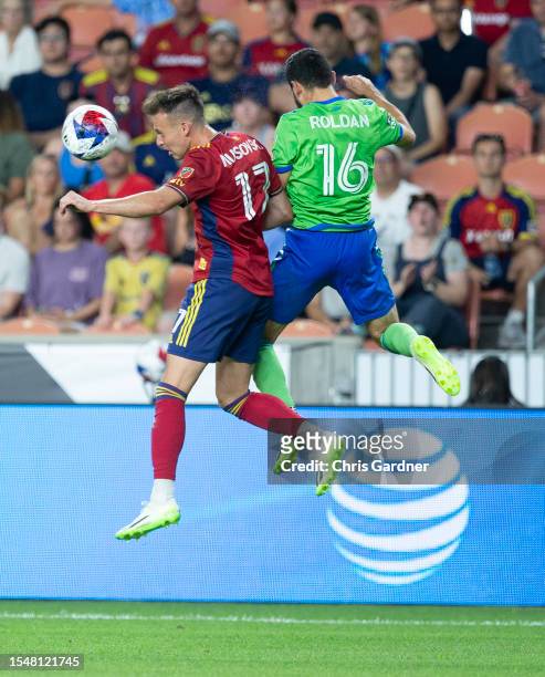 Danny Musovski of Real Salt Lake heads the ball away from Alexander Roldan of the Seattle Sounders during the second half of their Leagues Cup game...