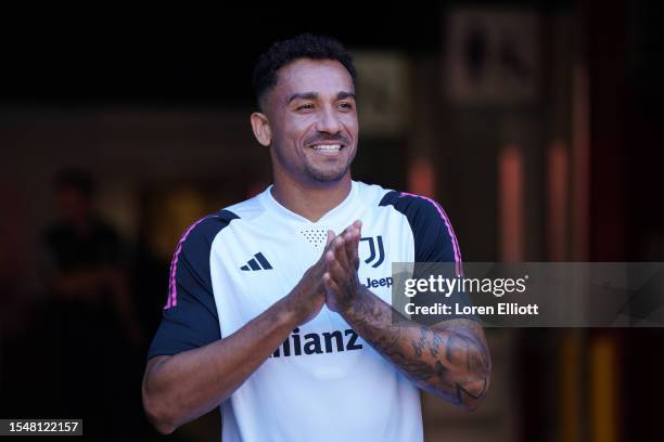 Danilo Luiz da Silva of Juventus walks to the pitch for a training session after the planned friendly against Barcelona was cancelled, at Levi's...