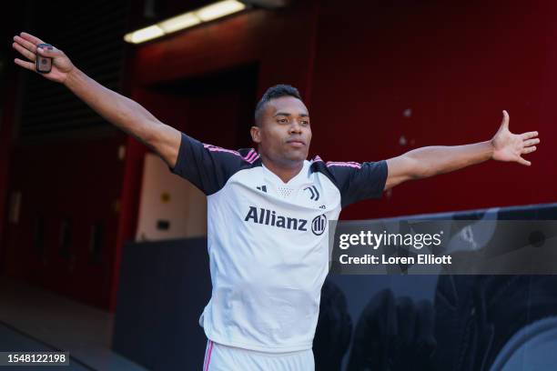 Alex Sandro of Juventus walks to the pitch for a training session after the planned friendly against Barcelona was cancelled, at Levi's Stadium on...