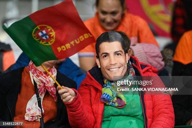 Portugal fan with a Cristiano Ronaldo mask is seen in the stands prior to the start of the Australia and New Zealand 2023 Women's World Cup Group E...