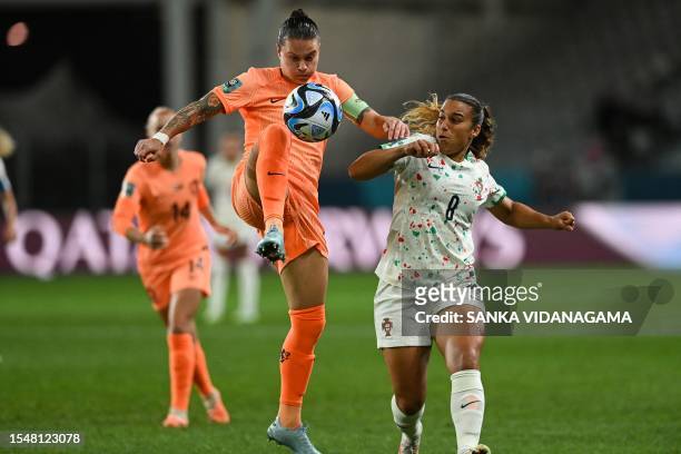 Portugal's midfielder Andreia Norton and Netherlands' midfielder Sherida Spitse fight for the ball during the Australia and New Zealand 2023 Women's...