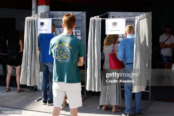 Citizens cast their votes for the general election at a polling station in Madrid, Spain on July 23, 2023.