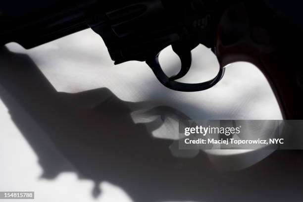 gun and its shadow. - revenge stock pictures, royalty-free photos & images