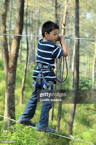 Boy Playing With Ropes 500 Boys Walking On Ropes Stock Photos, High-Res Pictures, and Images ...