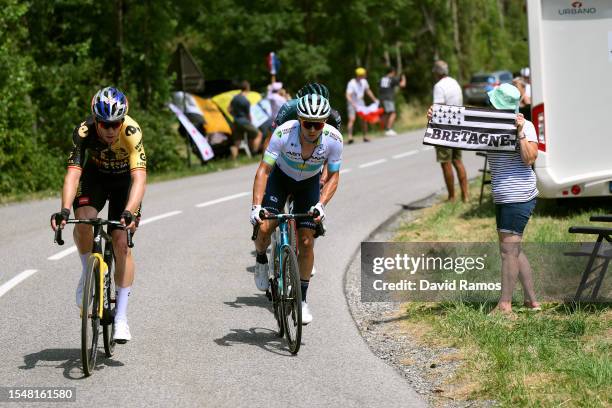 Wout Van Aert of Belgium and Team Jumbo-Visma and Alexey Lutsenko of Kazakhstan and Astana Qazaqstan Team compete in the breakaway while fans cheer...