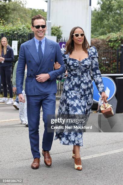 Tom Hiddleston and Zawe Ashton attend day fourteen of the Wimbledon Tennis Championships at All England Lawn Tennis and Croquet Club on July 16, 2023...