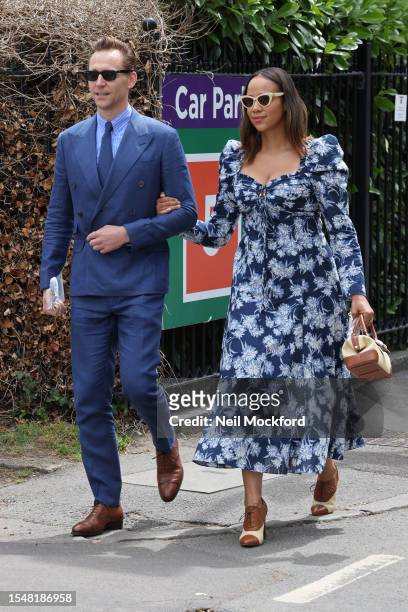 Tom Hiddleston and Zawe Ashton attend day fourteen of the Wimbledon Tennis Championships at All England Lawn Tennis and Croquet Club on July 16, 2023...
