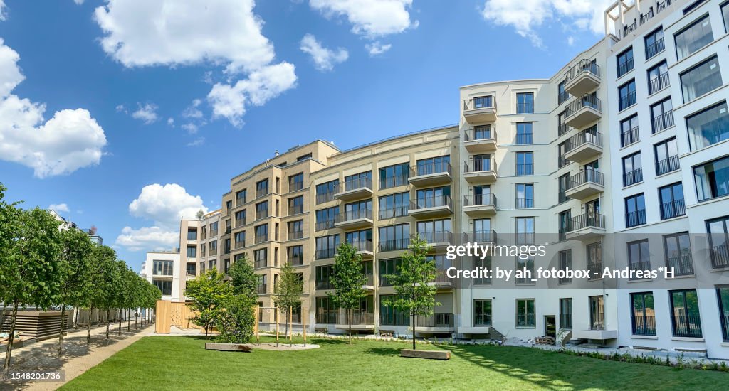 Residential area with ecological and sustainable green residential buildings, low-energy houses with apartments and green courtyard