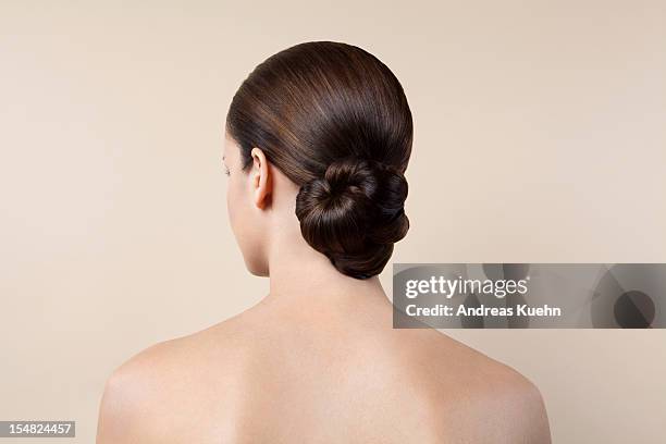 nude young woman with up do, back view. - haarknoten stock-fotos und bilder