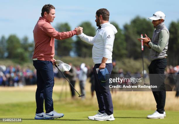 Robert MacIntyre of Scotland shakes hands with David Lingmerth of Sweden on the 18th green after finishing their round during Day Four of the Genesis...