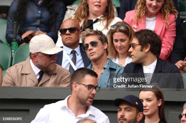 Guy Ritchie and actor, Brad Pitt are seen in the Royal Box ahead of the Men's Singles Final between Novak Djokovic of Serbia and Carlos Alcaraz of...