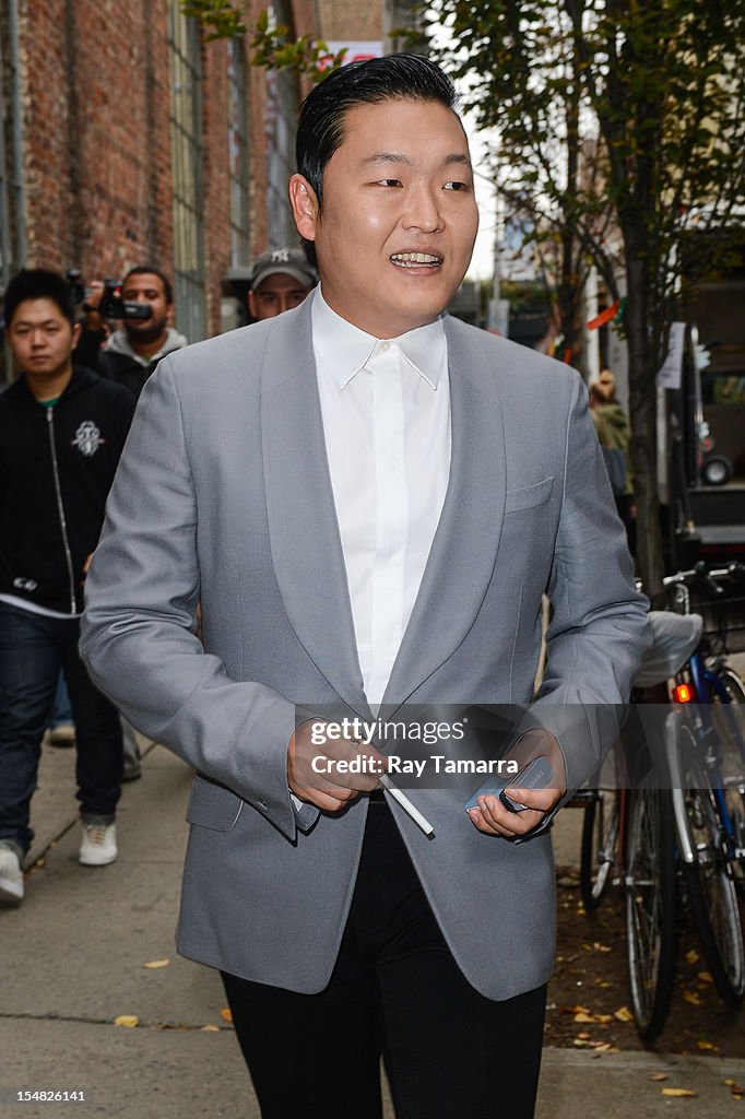 Psy Rapper Parents Rapper Psy walks to his trailer at a Korean beer commercial film set ...