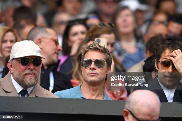 Guy Ritchie, Brad Pitt and Jeremy Kleiner watch Carlos Alcaraz vs Novak Djokovic in the Wimbledon 2023 men's final on Centre Court during day...