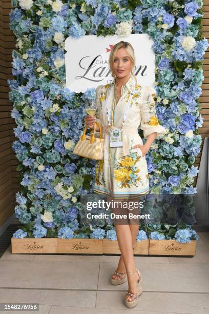 Laura Whitmore with Champagne Lanson at The Championships at Wimbledon on July 16, 2023 in London, England.