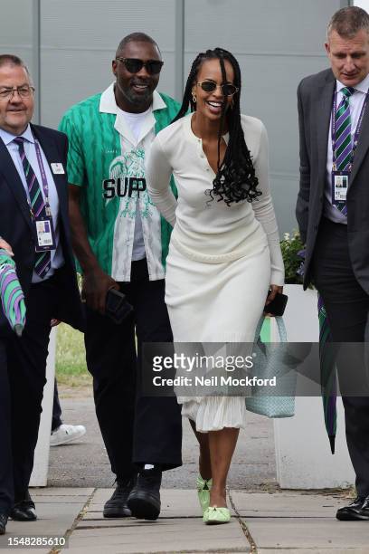 Idris Elba and Sabrina Dhowre Elba attend day fourteen of the Wimbledon Tennis Championships at All England Lawn Tennis and Croquet Club on July 16,...