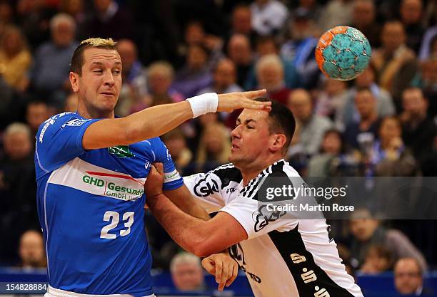 Pascal Hens of Hamburg is challenged by Marko Vujin of Kiel during the DKB Handball Bundesliga match between HSV Hamburg and THW Kiel at the O2 World...