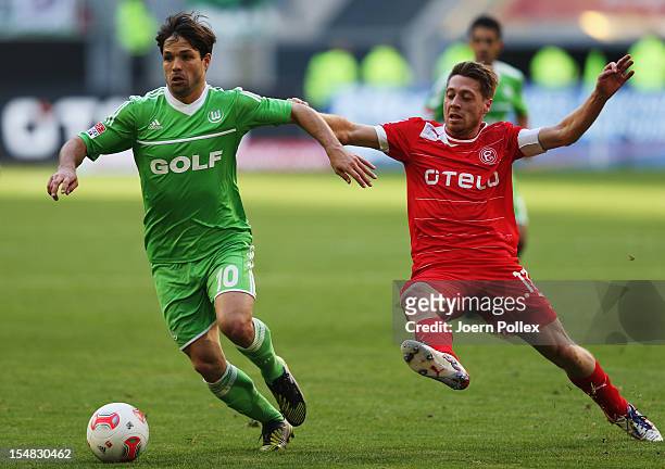 Andreas Lambertz of Duesseldorf and Diego of Wolfsburg compete for the ball during the Bundesliga match between Fortuna Duesseldorf 1895 and VfL...