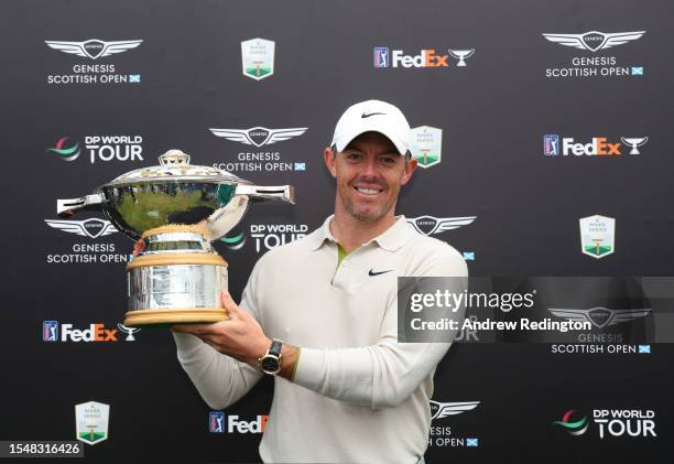 Rory McIlroy of Northern Ireland poses for a photo with the Genesis Scottish Open trophy after winning the tournament during Day Four of the Genesis...