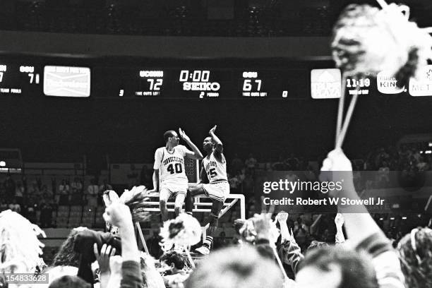 American basketball players Jeff King and Phil Gamble, of the University of Connecticut, celebrate their team's National Invitation Tournament...