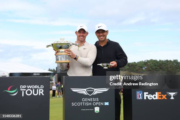 Rory McIlroy of Northern Ireland poses for a photo with his caddie Harry Diamond and the Genesis Scottish Open trophy after winning the tournament...
